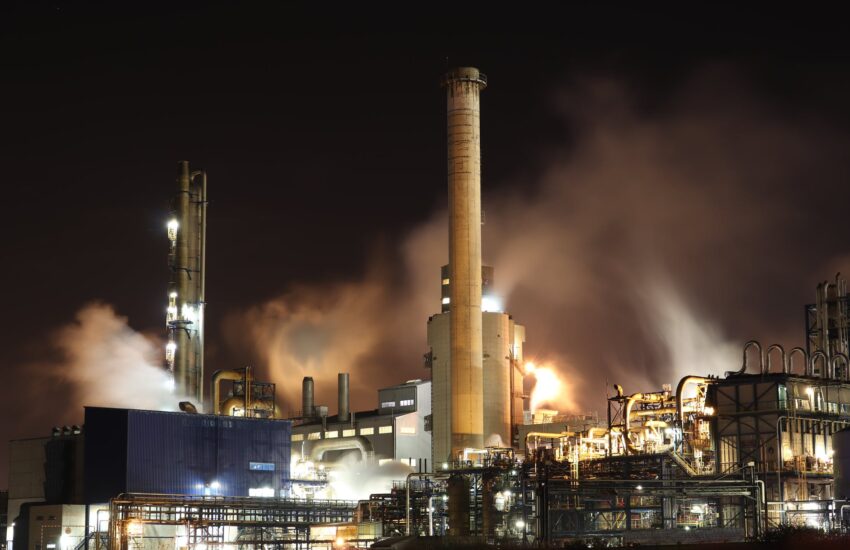 brown and white factory building during night time