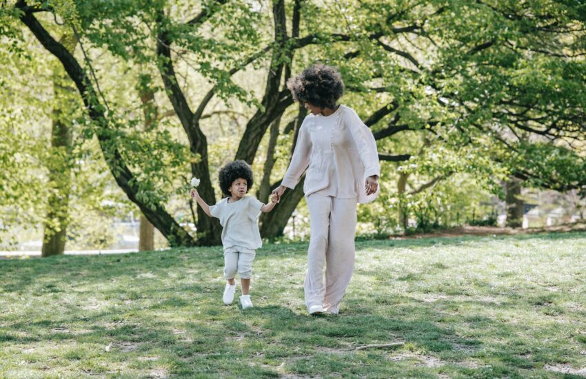 mother and daughter walking holding hands